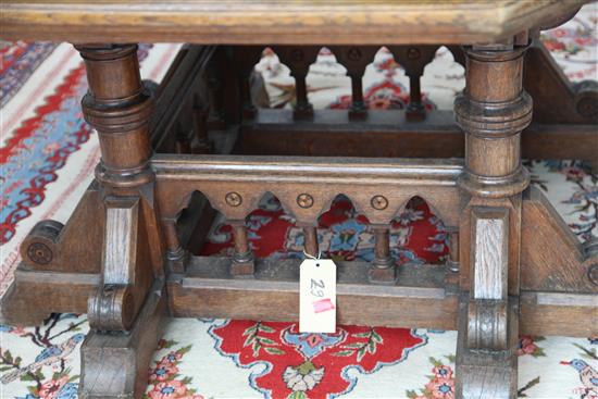 A Victorian gothic revival oak centre table, designed by Collier & Plucknett, Warwick, W.5ft D.5ft H.2ft 7in.